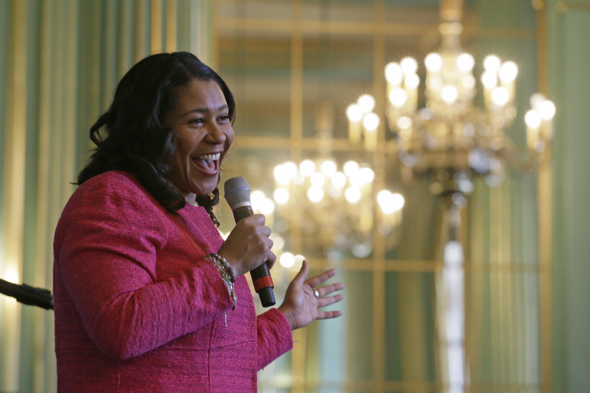 Mayor London Breed laughs as she addresses the annual Women In Construction Expo in San Francisco.